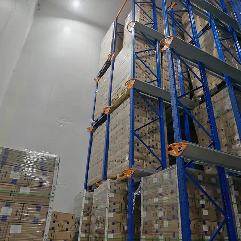 frozen strawberries storage warehouse with stacked cartons